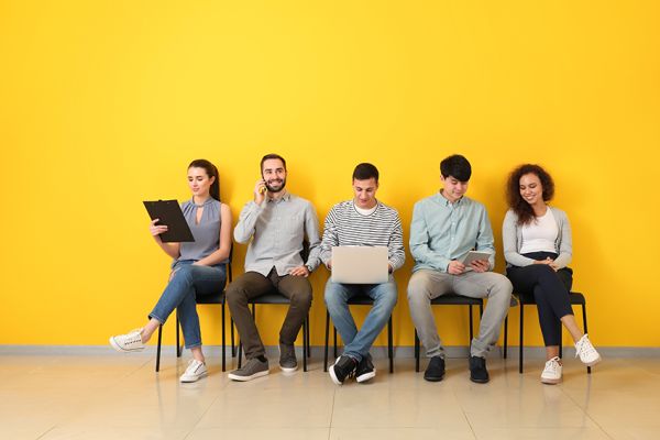 Young people waiting for job interview indoors